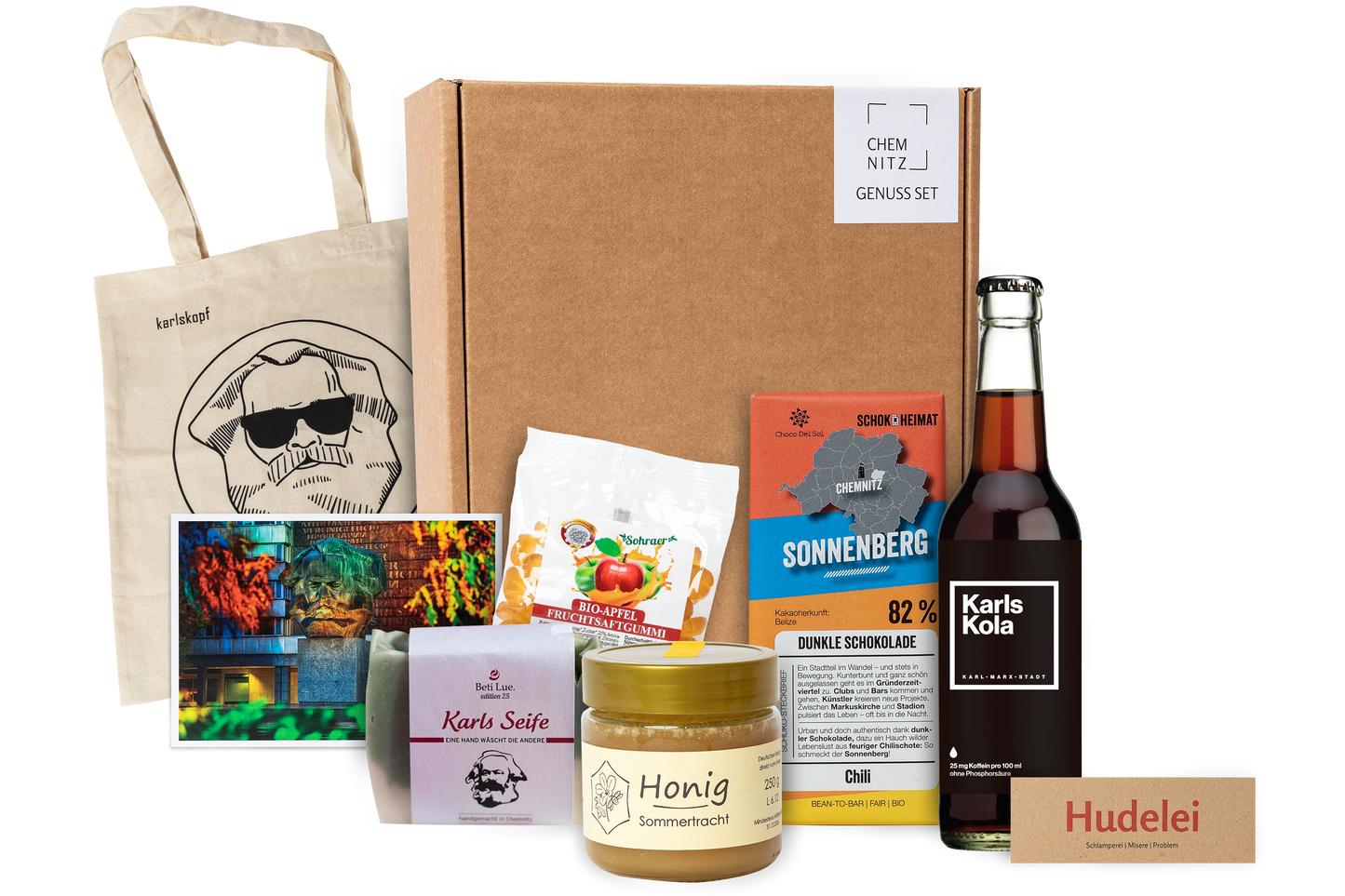 Genuss Set Chemnitz Basis mit Stofftasche, Bio Fruchtgummi, Karls Seife, Honig im Glas, Schokolade, Karls Kola, alles in einem braunen Karton.